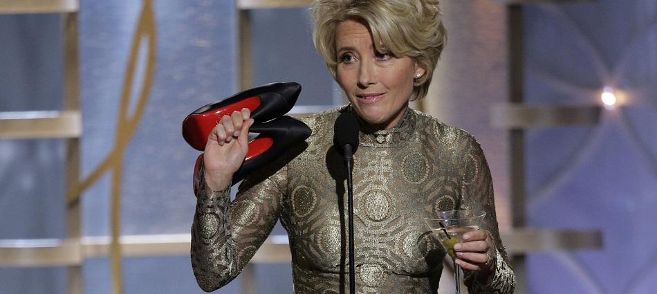 Emma Thompson takes off her shoes during the 71st annual Golden Globe Awards in Beverly Hills